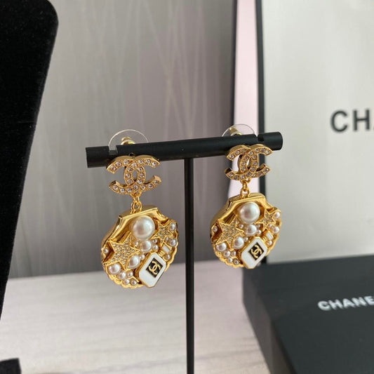 Aretes C concha de mar dos vistas dorados